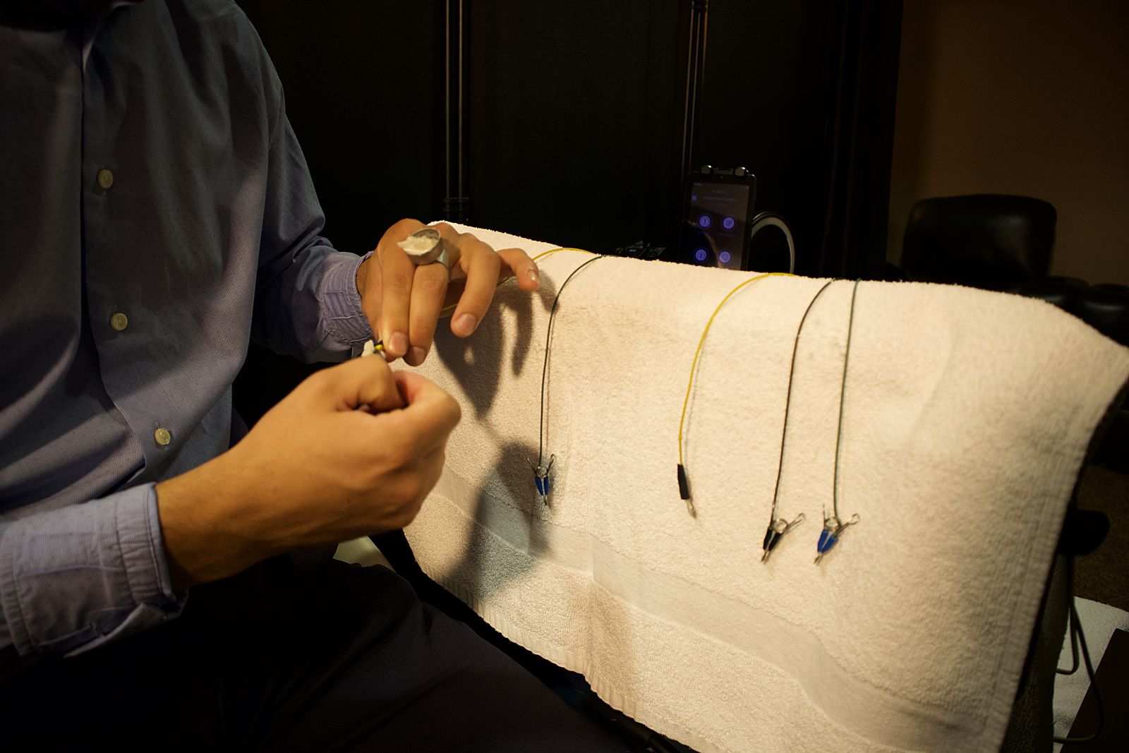 A technologist preparing equipment before a session